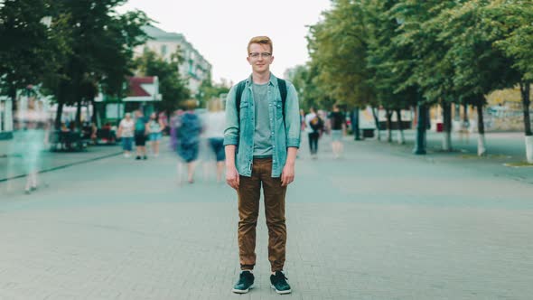 Time-lapse of Handsome Man Standing in the Street of Big City Looking at Camera