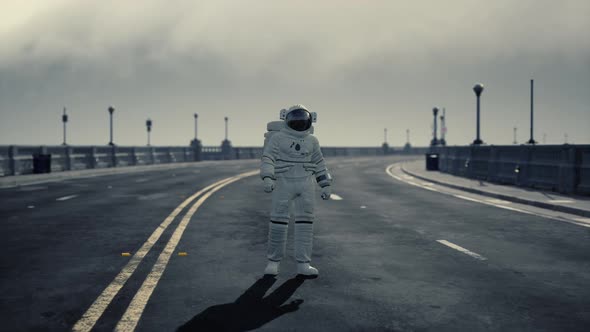 Astronaut Walks in the Middle of a Road alt