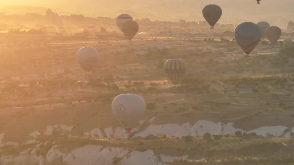 Aerial Cinematic Drone View of Colorful Hot Air Balloon Flying Over Cappadocia