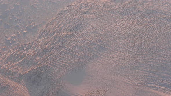 View From Plane Window On Glacial Fields Of Greenland In Light Of Scarlet Sunset