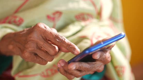 Senior Women Hand Using Smart Phone Close Up