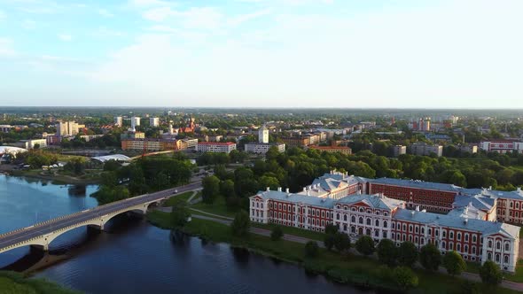 Aerial View of Jelgava City Panorama and Lielupe River in Latvia, Zemgale at Sunset 4K Dron Shot alt