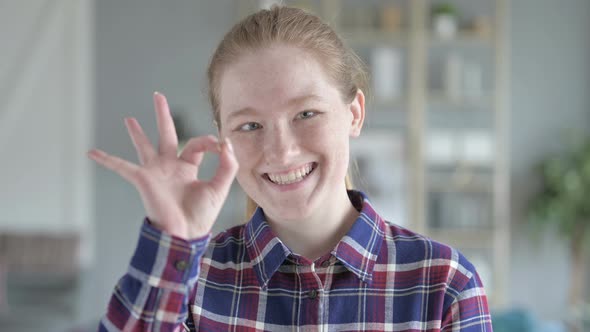 Close Up of Young Woman Showing Approval Gesture With Hand