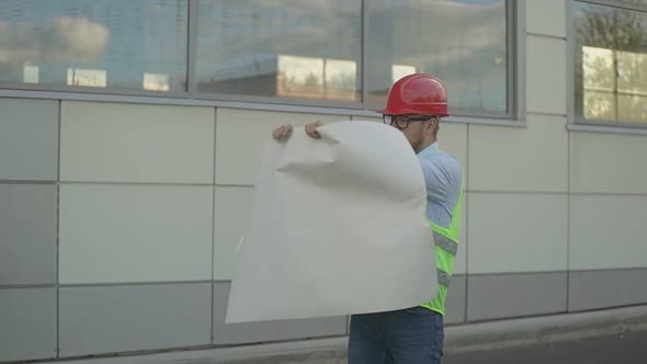 Engineer Looks at the Drawing