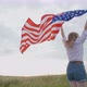 Patriotic Young Woman Holds the US Flag and Runs Across the Field - VideoHive Item for Sale