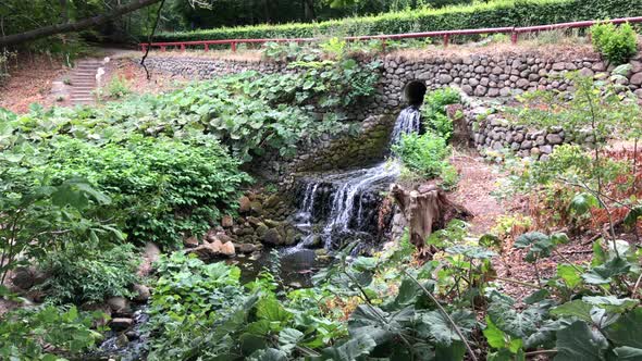 A small waterfall under the bridge. Taken in Aarhus, Denmark.