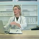 Smiling Nurse with Laptop Scheduling Appointment for Male Patient at Reception - VideoHive Item for Sale
