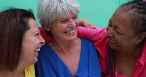 Joyful elderly women having fun in the city - Senior multiracial friendship concept