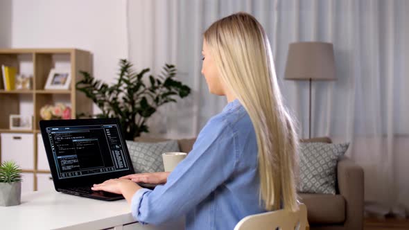 Woman Typing on Laptop with Green Screen at Home