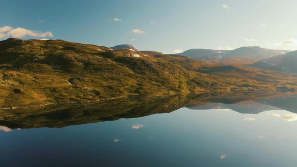 Absolute Mesmerizing Reflection Of The Beautiful Mountain Touched By The Morning Sunlight In Norway