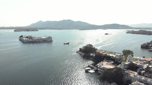 Panoramic view from Ambrai Ghat over Lake Pichola and Taj Lake Palace in Udaipur, Rajasthan, India