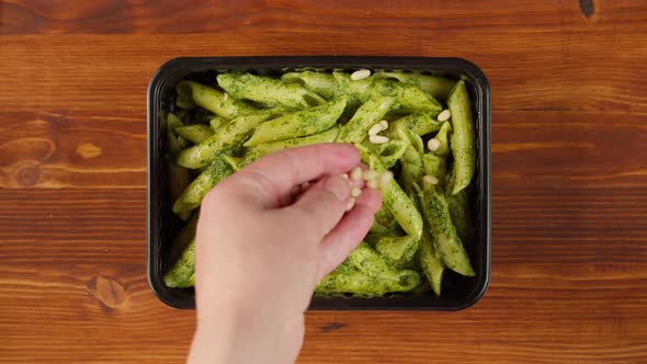 Pasta with Pesto Sauce and Pine Nuts Closeup