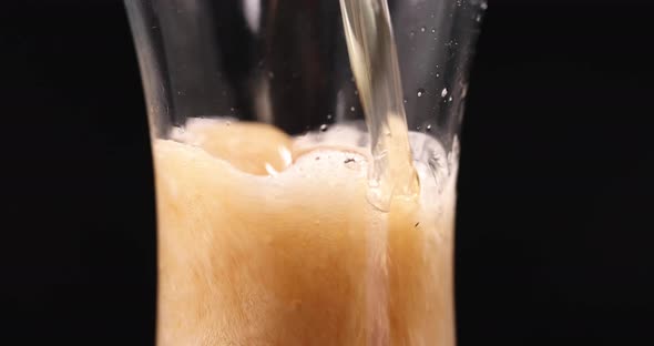 Foamy Drink is Poured Into Transparent Glass Beaker  Movie