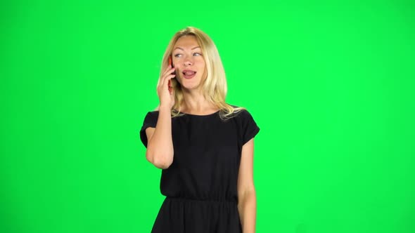 Girl Goes and Speaks on the Phone. Chroma Key. Slow Motion