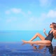 Young asian woman enjoy around outdoor swimming pool for leisure - VideoHive Item for Sale