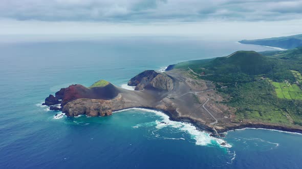 Picturesque Green Island with Capelinhos Volcano on Faial Island Azores