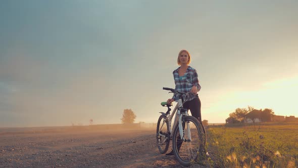 Portrait shot of happy woman with bicycle