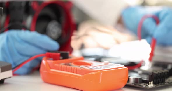 Multimeter Tester Lying on Table in Computer Workshop  Movie Slow Motion