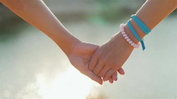 Two Woman Tenderly Hold Hands Romantic Couple