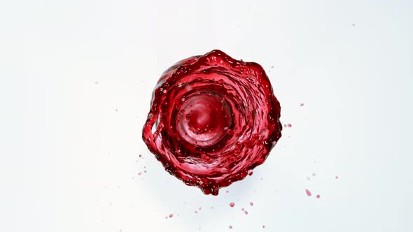 Super Slow Motion Shot of Red Wine Vortex Splash Isolated on White Background at 1000 Fps