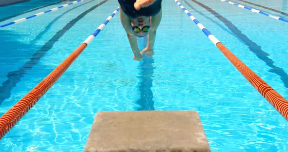 Female swimmer jump in to the pool for swimming 4k