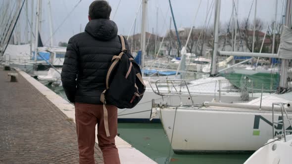 Tourist Is Walking on Embankment of Via Destra Del Port in Rimini