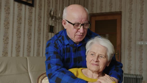 Portrait of the Senior Caucasian Couple Hugging and Looking at Each Other Love and Affaction at