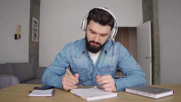 Caucasian Man Wear Wireless Headphones Speaking Communicating By Webcam