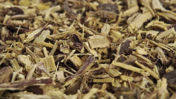 Chopped herbal licorice root rotates close-up