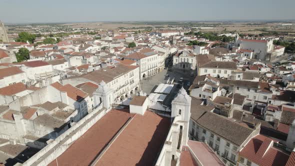 Aerial circling drone view over rooftop of Saint Andrew or Santo Antao Church, Evora