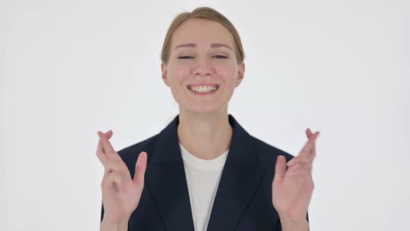 Young Businesswoman Praying with Fingers Crossed on White Background