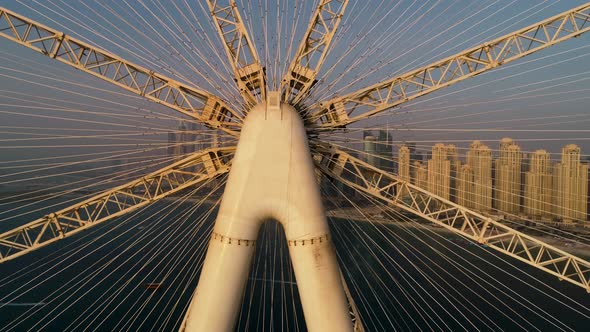 Aerial view passing by of the Ferris wheel under construction, Dubai.