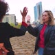 Women friends meeting outdoor in the city high five - VideoHive Item for Sale