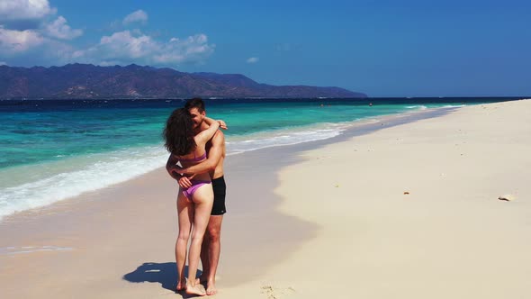 Fun Man and Woman in Love Dating on Vacation Spend Quality Time on Beach on Summer White Sandy Backg