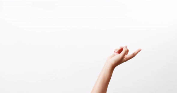 Close up of a woman making gestures with one arm with touching on a white studio background with cop