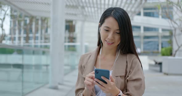 Young woman use of smart phone in city