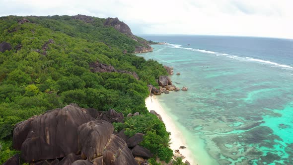 Aerial Pan Right of Anse Source D'argent Beach at La Digue Island Seychelles