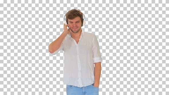 Casual young man listening to music holding, Alpha Channel