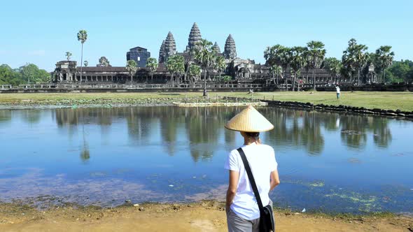 One tourist visiting Angkor ruins travel destination Cambodia