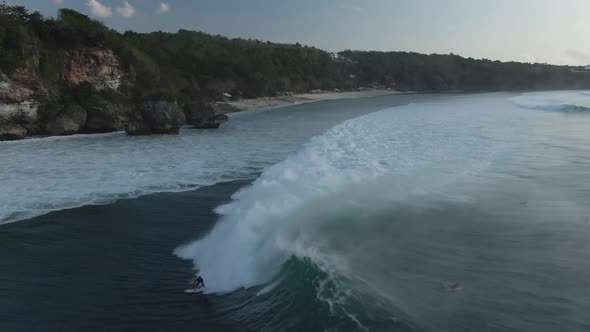 Aerial View Of Group Of Surfers In Ocean In Bali, Indonesia