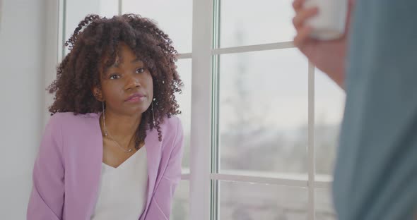 The African American businesswoman is listening to her business partner Home office Workspace