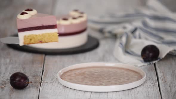 Piece of Delicious Mousse Cake with Whipped Cream and Plum Jelly