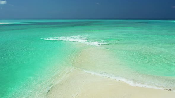 Natural aerial clean view of a sunshine white sandy paradise beach and blue water background in hi r