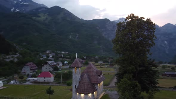 Flying Near Old Wooden Church and Trees in Thethi Valley Albania