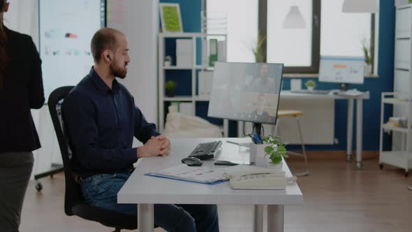 Businessman Using Video Call on Computer for Meeting