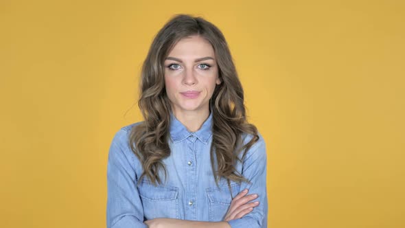 Sad Upset Young Girl Isolated on Yellow Background