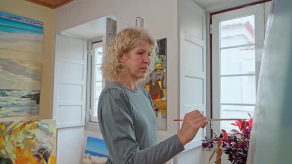 Woman Artist of Drawings Preparing to Create a Abstract Painting Image