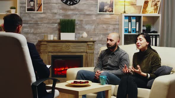 Sad Boyfriend Sitting on Couch at Couple Therapy