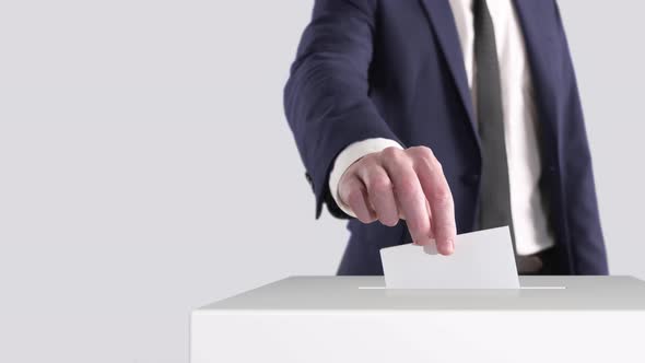 Voting. Man Putting a Ballot into a Voting Box With Space for Text or Logo.