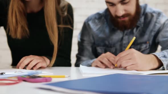 Closeup View of Happy Diverse Multiethnic Students or Young Business Team Working on a Project or